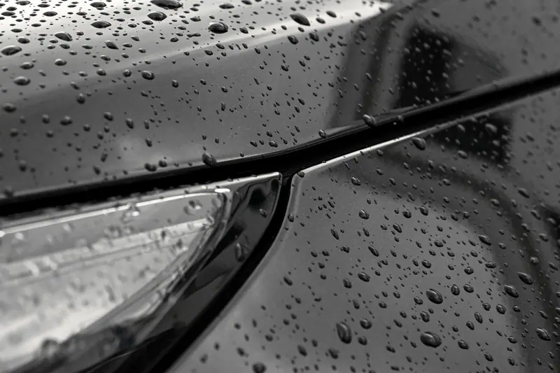 Tight water beads on a coated black hood
