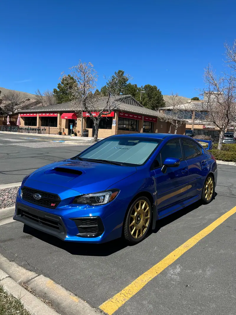 Blue Subaru WRX STI front three quarter view after coating