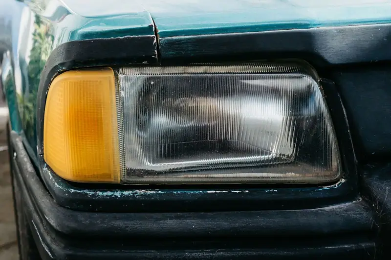 Oxidized, cloudy headlight on an older car