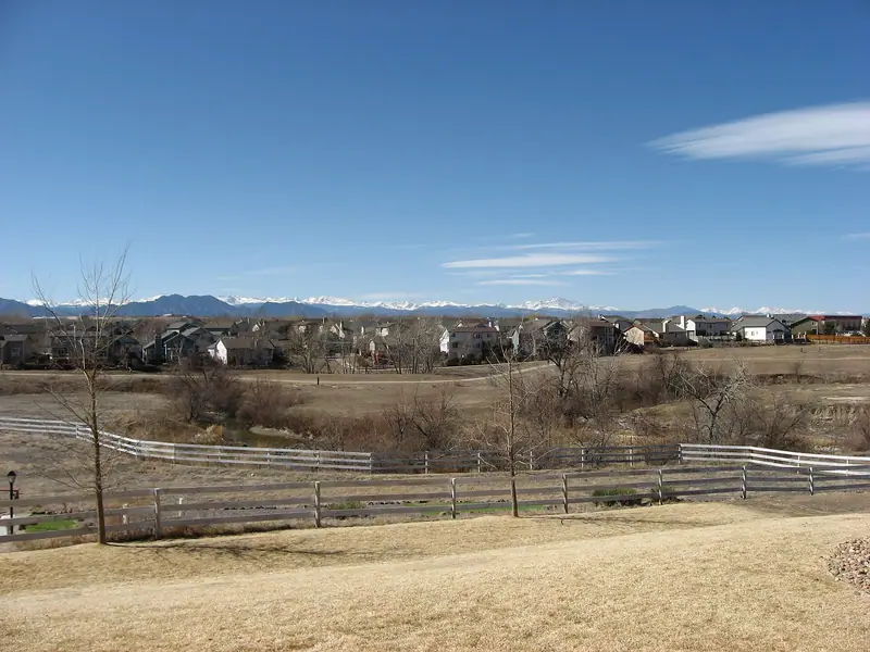 Denver metro neighborhoods with the snowcapped Front Range behind