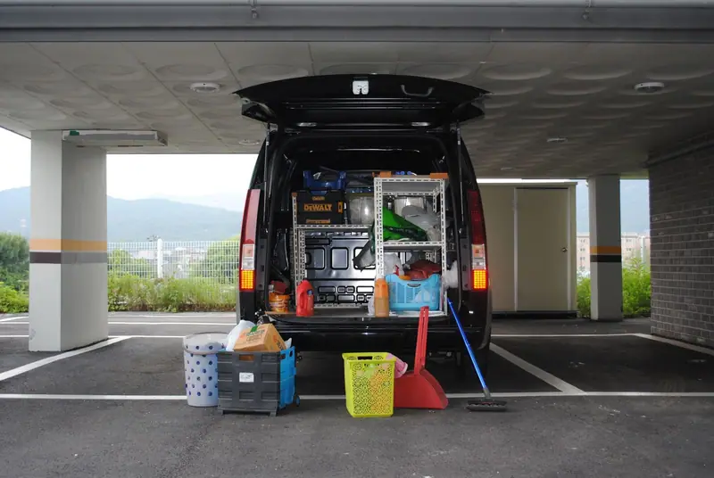 Open van with detailing buckets and supplies ready for a mobile job