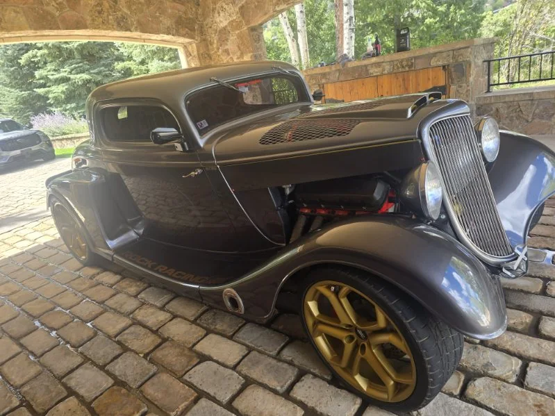 The same 1930s Ford coupe hot rod from the other side, gloss on the gray paint